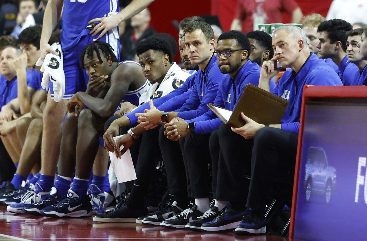 Duke head coach Jon Scheyer and the bench watch late in the second half of N.C. State’s 84-60 victory over Duke at PNC Arena in Raleigh, N.C., Wednesday, Jan. 4, 2023.