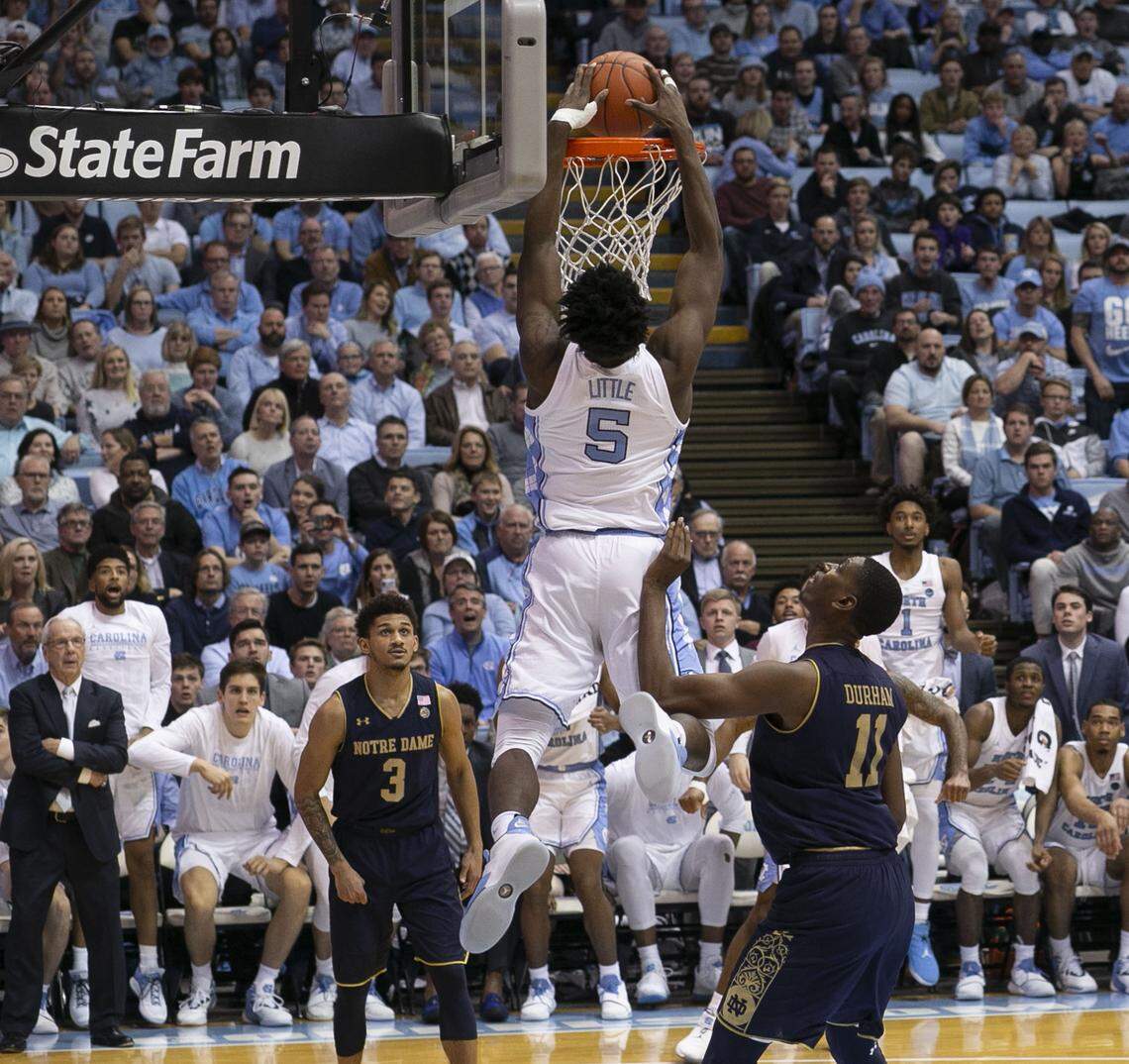 North Carolina’s Nassir Little (5) gets a dunk over Notre Dame’s Prentiss Hubb (3) and Juwan Durham (11) in the second half on Tuesday, January 15, 2019 at the Smith Center in Chapel Hill, N.C.