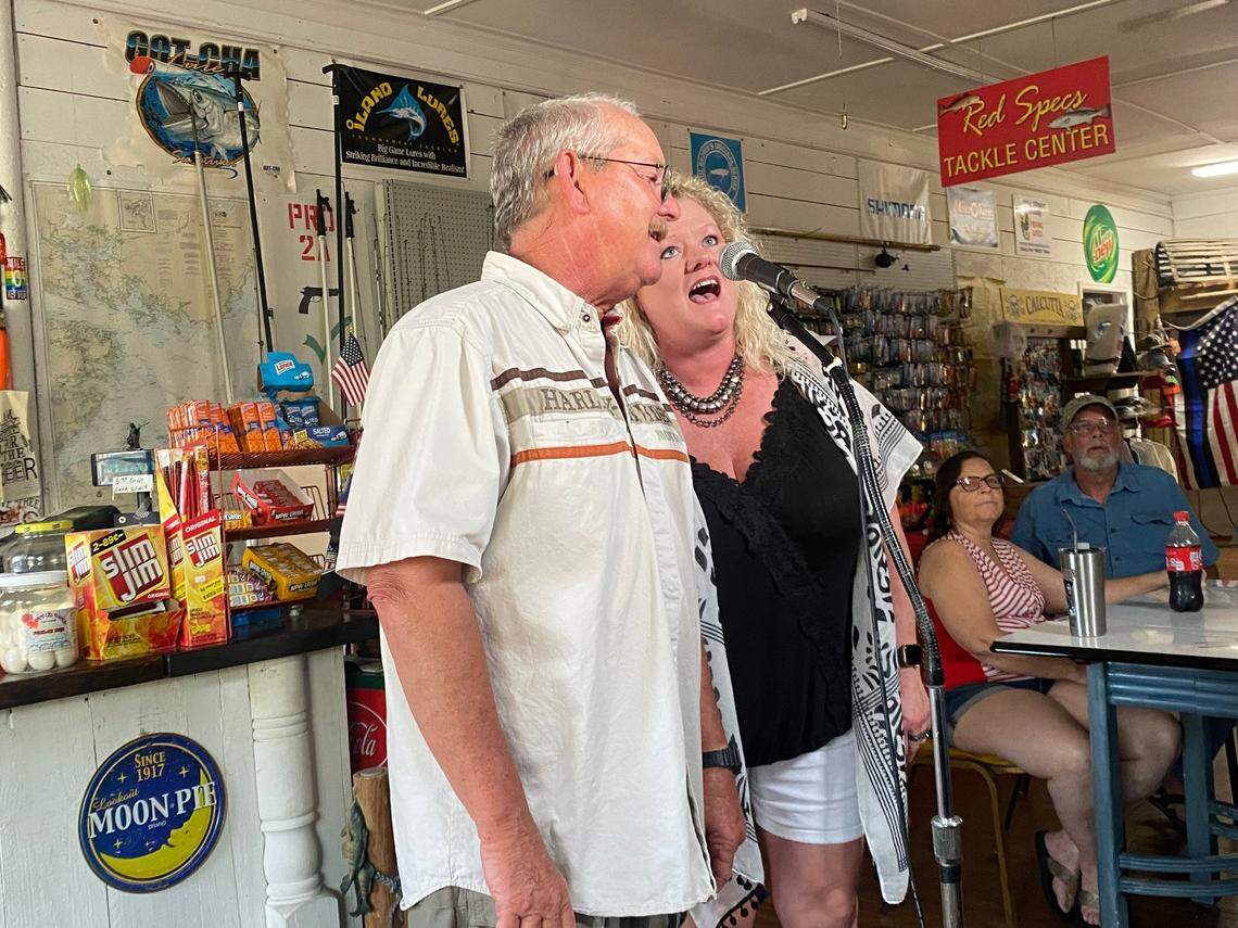 Russ Hudson and Jamey Thomas kick off karaoke night at Squidders Back & Tackle in Vandemere, near the Pamlico Sound, which has hosted Saturday night singalongs since getting flooded in Hurricane Florence.