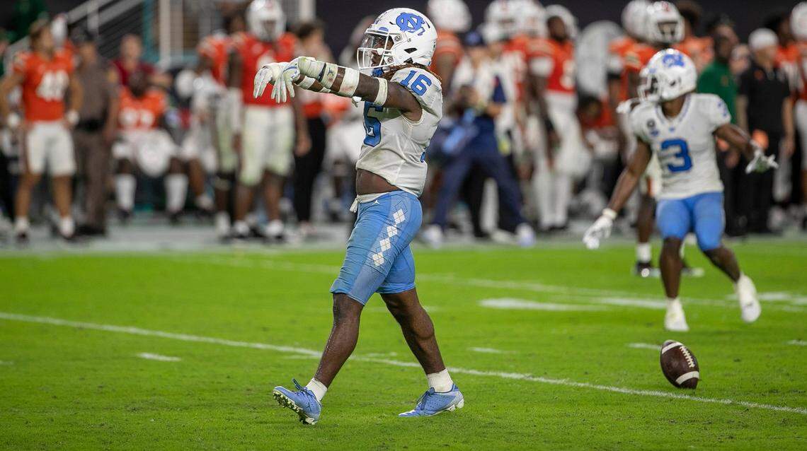 North Carolina defensive back DeAndre Boykins (16) reacts after his interception of Miami quarterback Tyler Van Dyke with eight seconds to play to secure the Tar Heels’ 27-24 victory on Saturday, October 8, 2022 at Hard Rock Stadium in Miami Gardens, Florida.