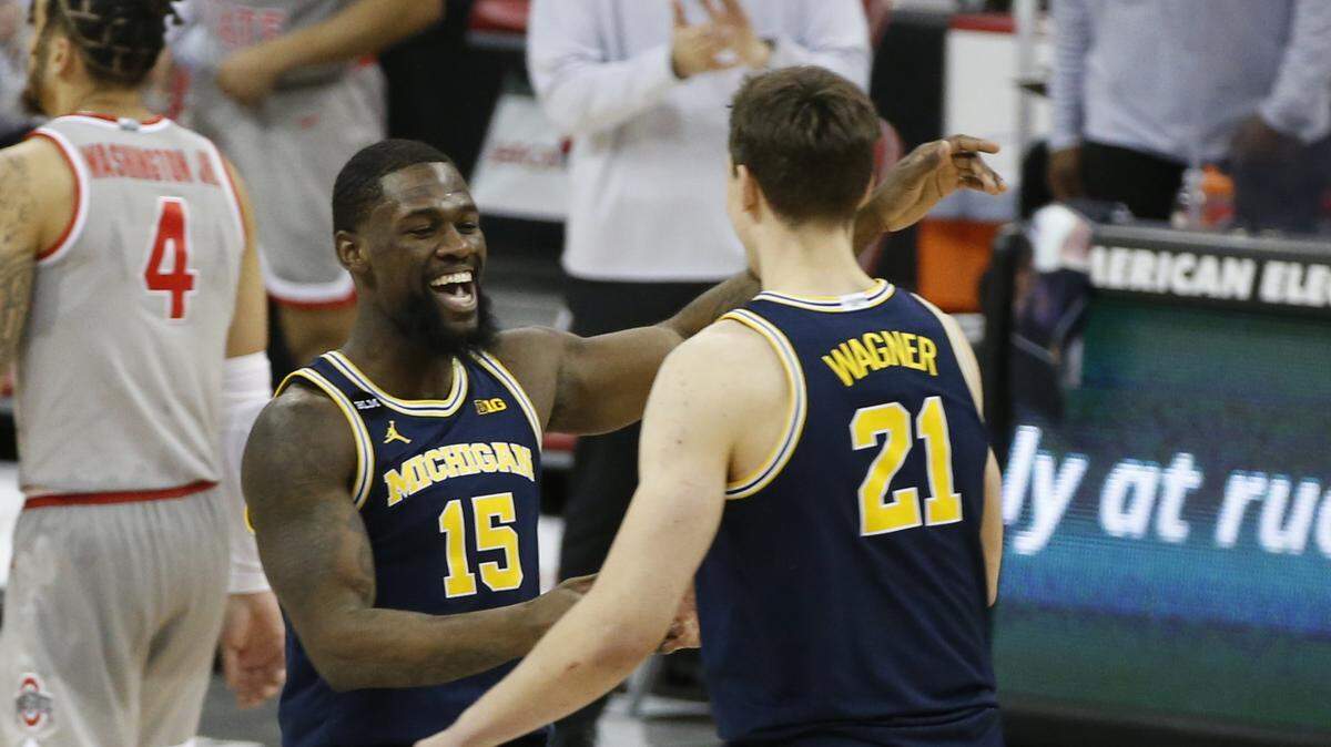 Michigan’s Chaundee Brown, left, and Franz Wagner celebrates their win over Ohio State after an NCAA college basketball game Sunday, Feb. 21, 2021, in Columbus, Ohio. (AP Photo/Jay LaPrete)
