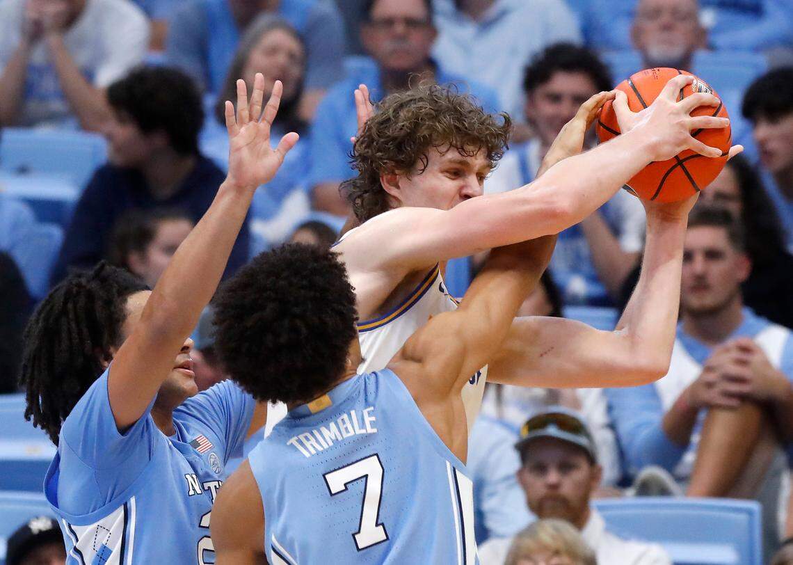 North Carolina’s Elliot Cadeau and Seth Trimble swarm UC Riverside’s Benjamin Griscti during the second half of the Tar Heels’ 77-52 win on Friday, Nov. 17, 2023, at the Smith Center in Chapel Hill, N.C.