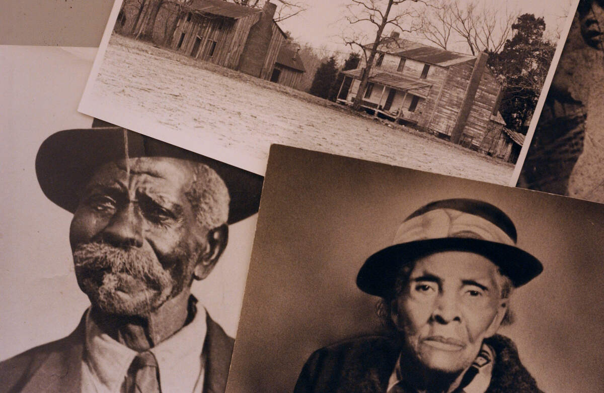 Undated photos of two of the residents of Stagville, born into slavery: left, Doc Edwards, born 1850; and Amy Shaw, right, born 1850. Above photo is of some of the four still standing slave cabins in Stagville’s Horton Grove.