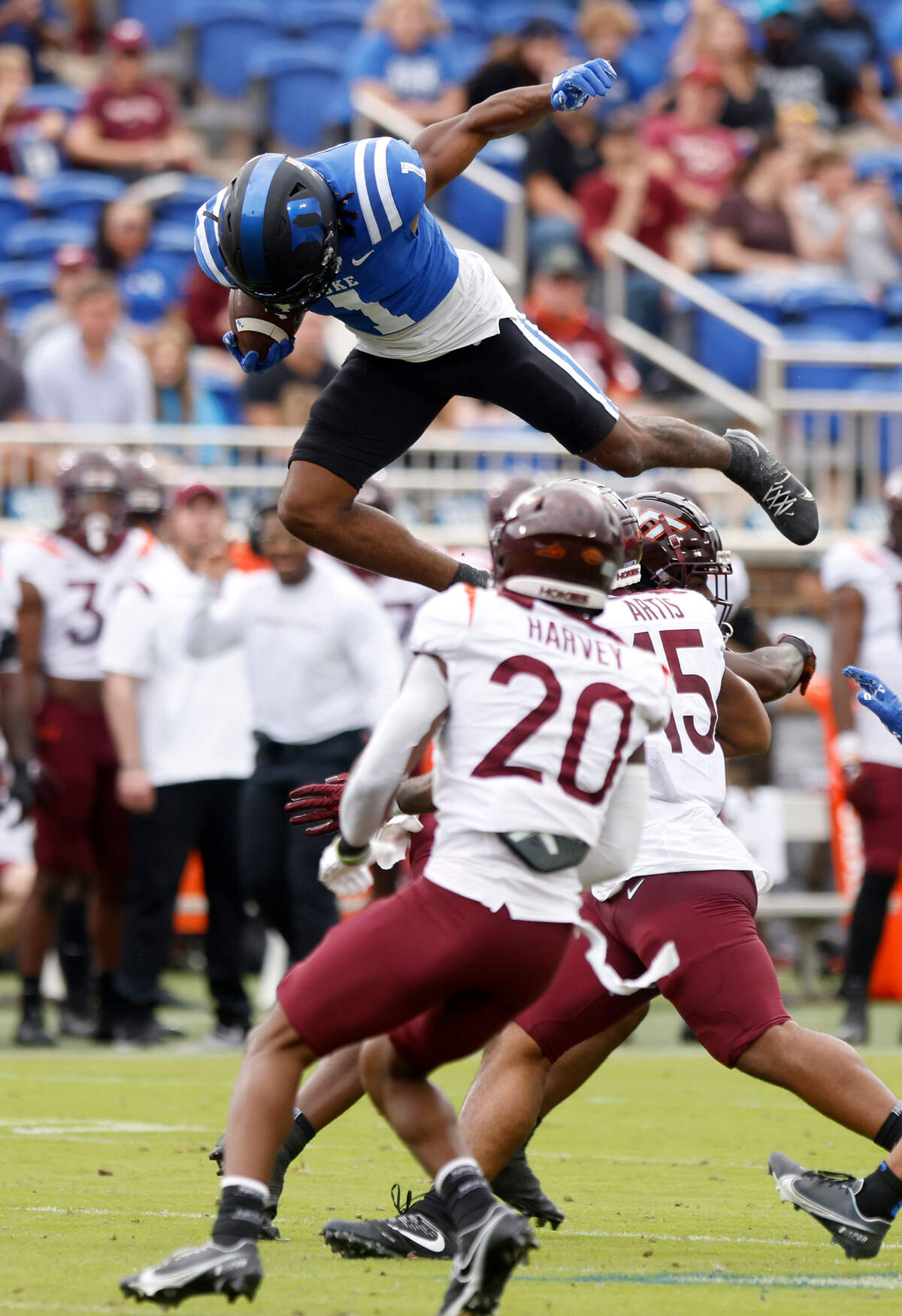 Duke Blue Devils wide receiver Jontavis Robertson jumps over the Virginia Tech defense during the first half of a football game at Wallace Wade Stadium on Saturday, Nov. 12, 2022, in Durham, N.C.