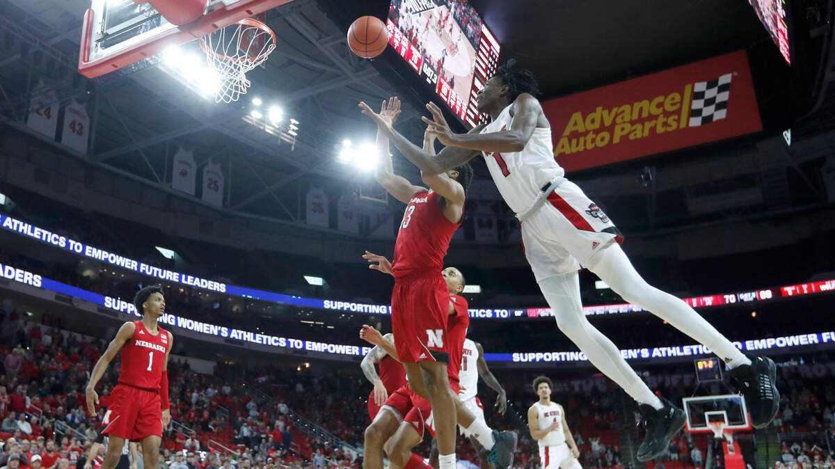 \N.C. State’s Dereon Seabron (1) shoots as Nebraska’s Derrick Walker (13) defends during N.C. State’s 104-100 victory over Nebraska in four overtimes at PNC Arena in Raleigh, N.C., Wednesday, December 1, 2021.
