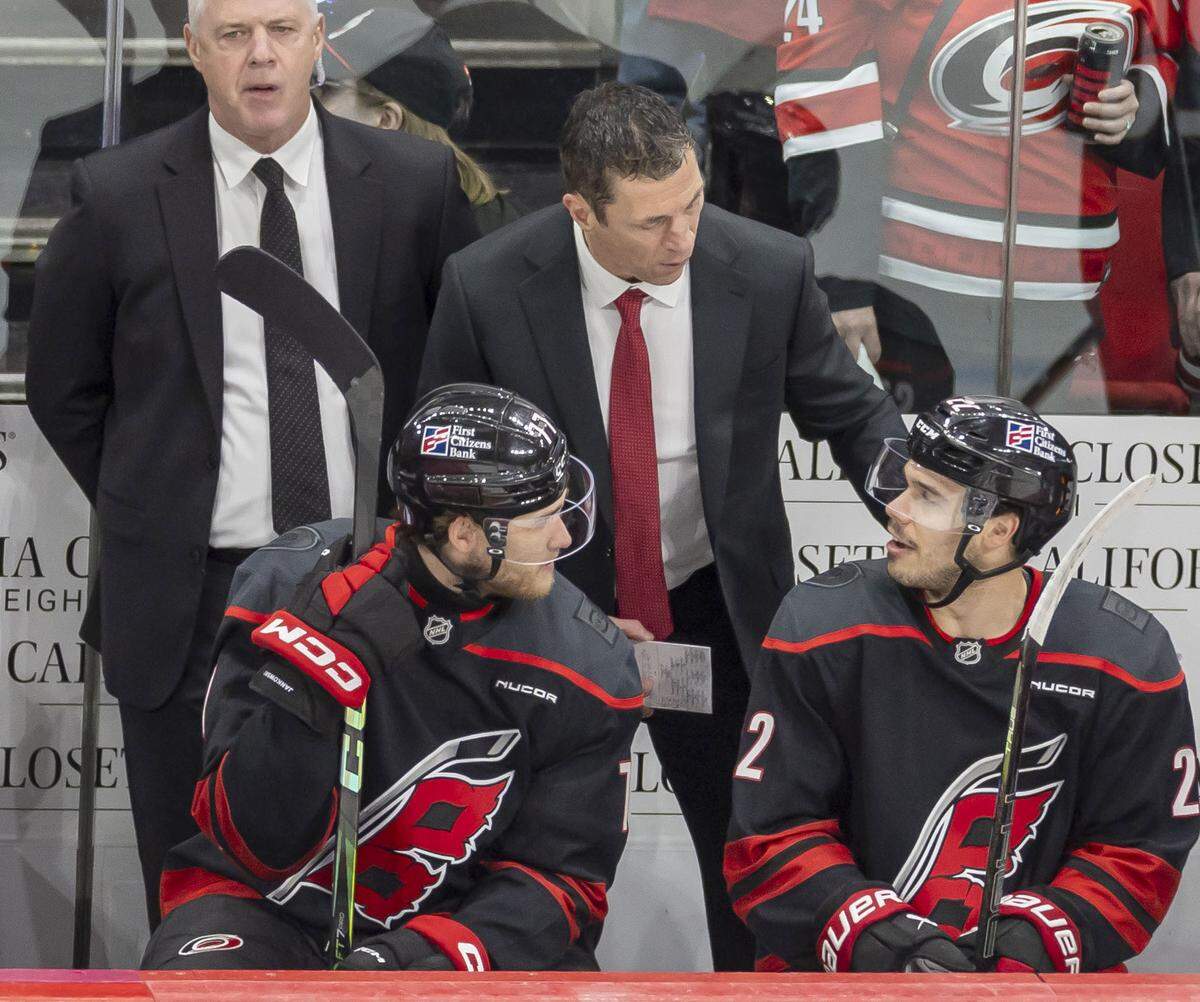 Carolina Hurricanes head coach Rod Brind’Amour talks center Logan Stankoven (22) in the third period of Game 1 on Saturday, May 2, 2026, during the second round of the Stanley Cup Playoffs at Lenovo Center in Raleigh, N.C. 