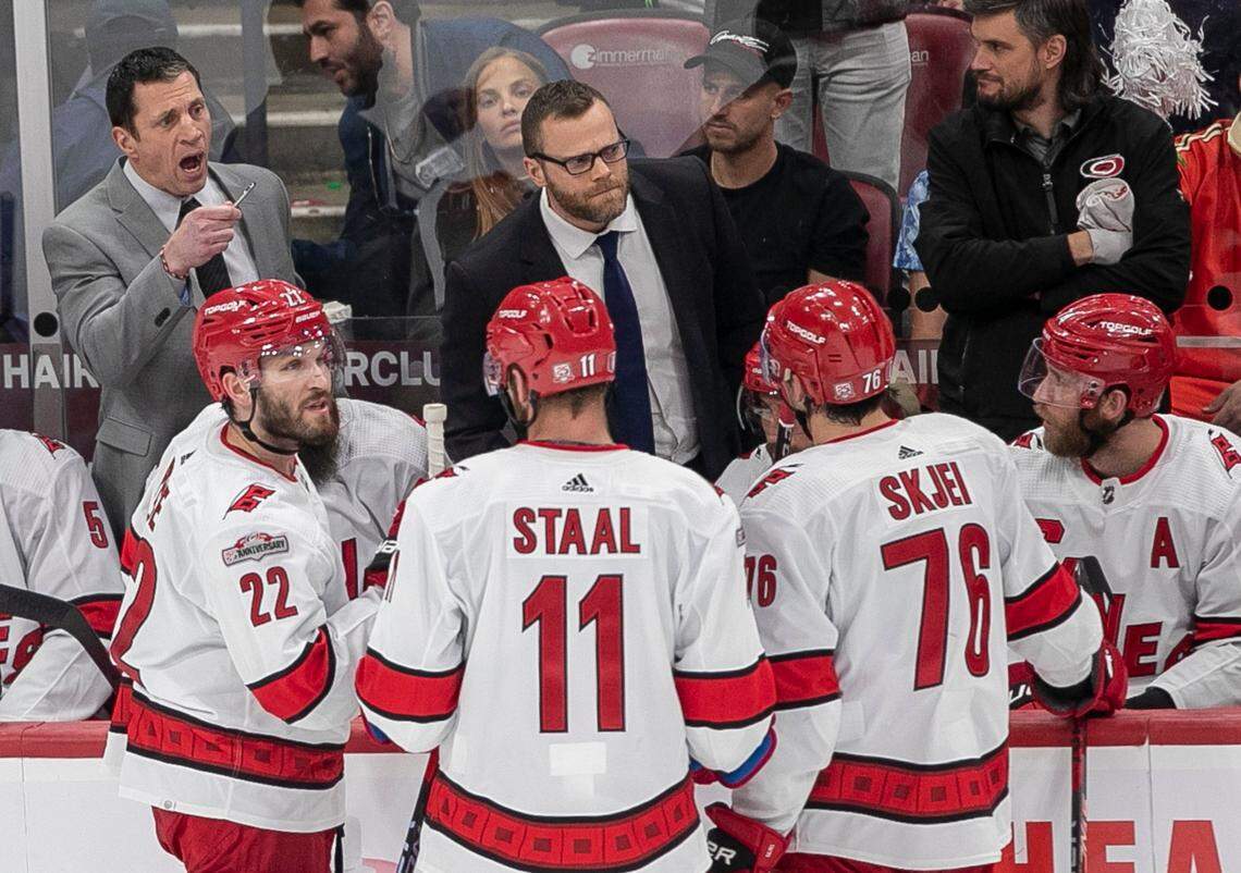 Carolina Hurricanes coach Rod Brind’Amour talks with his players during a time out in the second period during Game 3 of the Eastern Conference Finals against the Florida Panthers on Monday, May 22, 2023 at FLA Live Arena in Sunrise, Fla.