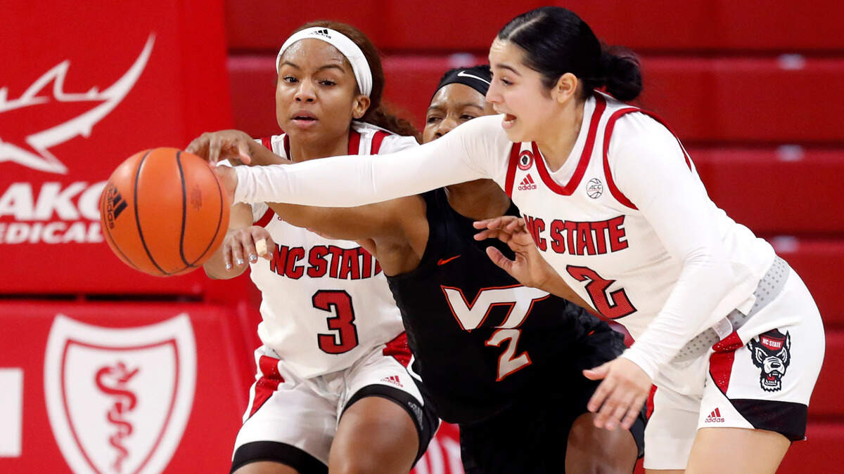 N.C. State’s Kai Crutchfield (3), left and Raina Perez (2) take the rebound from Virginia Tech’s Aisha Sheppard (2) during the second half of N.C. State’s 89-87 victory over Virginia Tech at Reynolds Coliseum in Raleigh, N.C., Sunday, January 24, 2021.