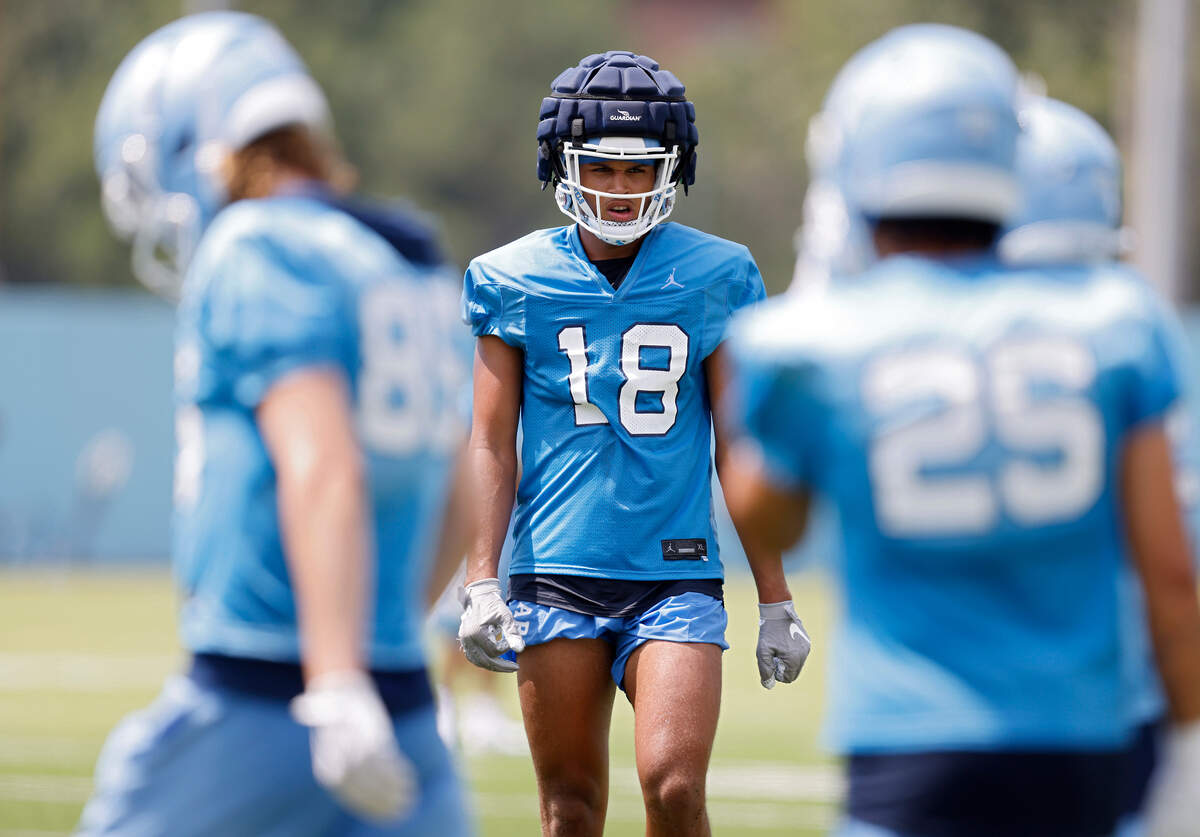 North Carolina tight end Bryson Nesbit runs a drill during UNC’s first football practice of the season on Friday, July 29, 2022, in Chapel Hill, N.C.