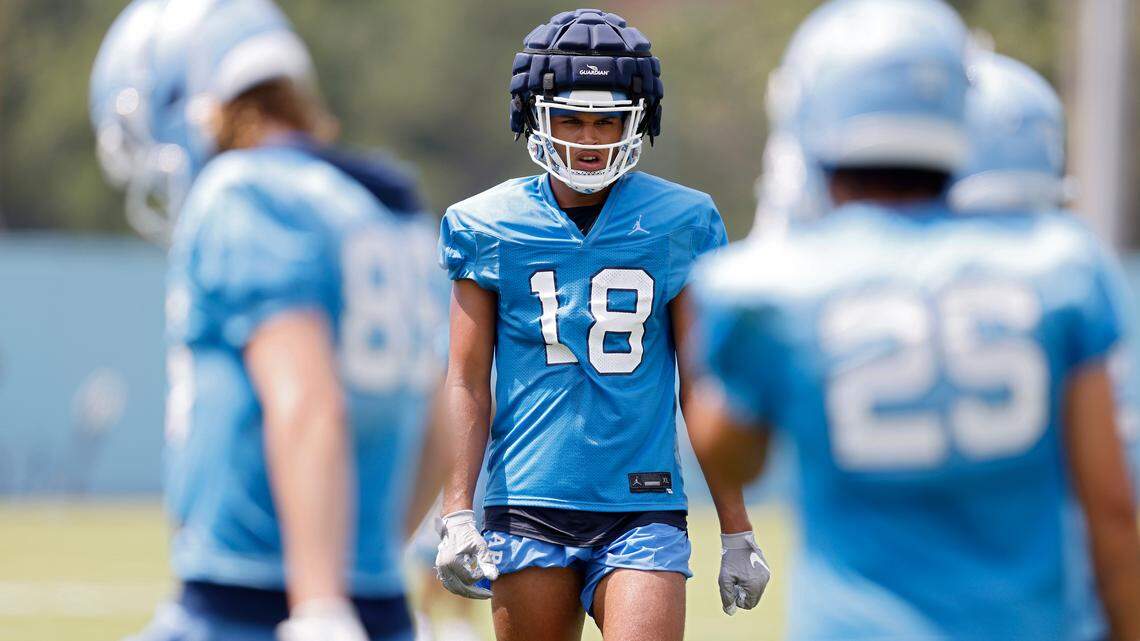 North Carolina tight end Bryson Nesbit runs a drill during UNC’s first football practice of the season on Friday, July 29, 2022, in Chapel Hill, N.C.