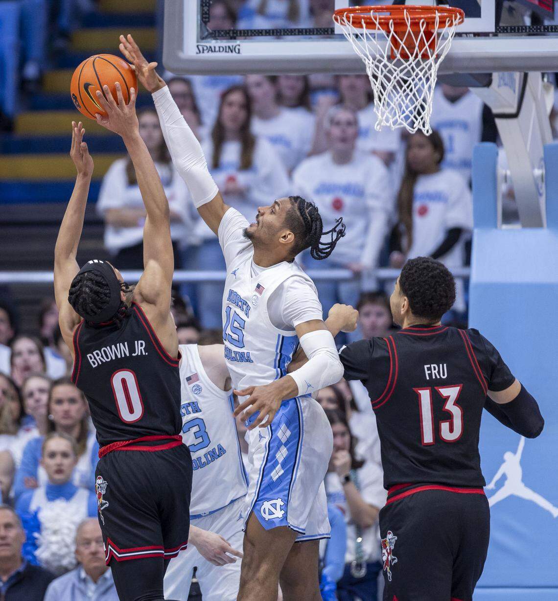 North Carolina forward Jarin Stevenson (15) defends Louisville guard Mikel Brown Jr. (0) in the first half on Monday, February 23, 2026 at the Smith Center in Chapel Hill, N.C.