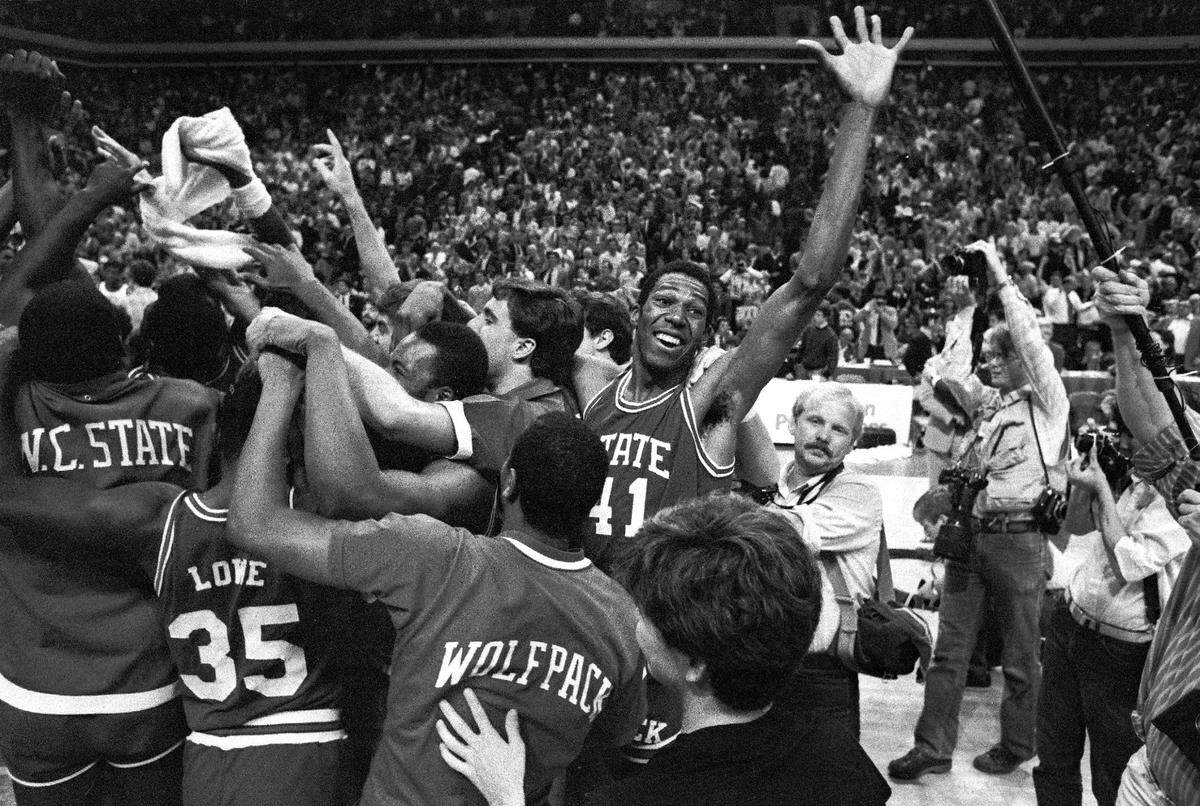 N.C. State’s Thurl Bailey waves to fans as the Wolfpack celebrates winning the championship game of the 1983 ACC Tournament over Virginia.