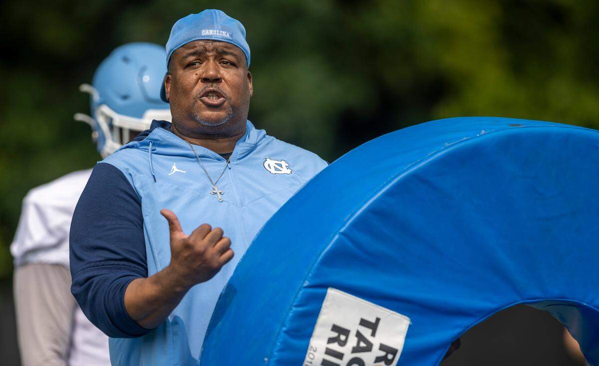 North Carolina defensive line coach Tim Cross works with his players during the Tar Heels’ practice on Wednesday, August 2, 2023 in Chapel Hill, N.C.