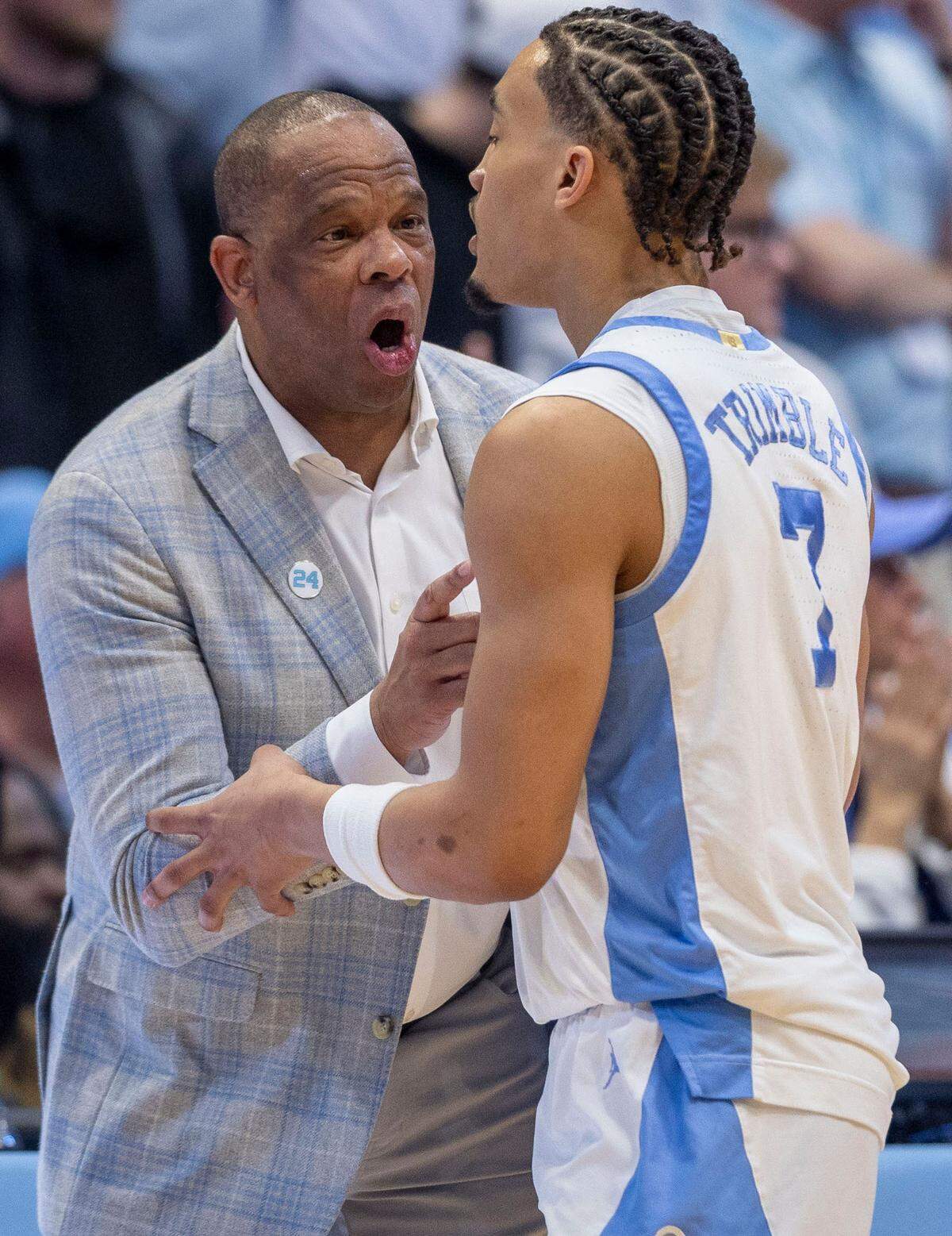 North Carolina coach Hubert Davis has a word with Seth Trimble (7) in the second half against Duke on Saturday, March 8, 2025 at the Smith Center in Chapel Hill, N.C.