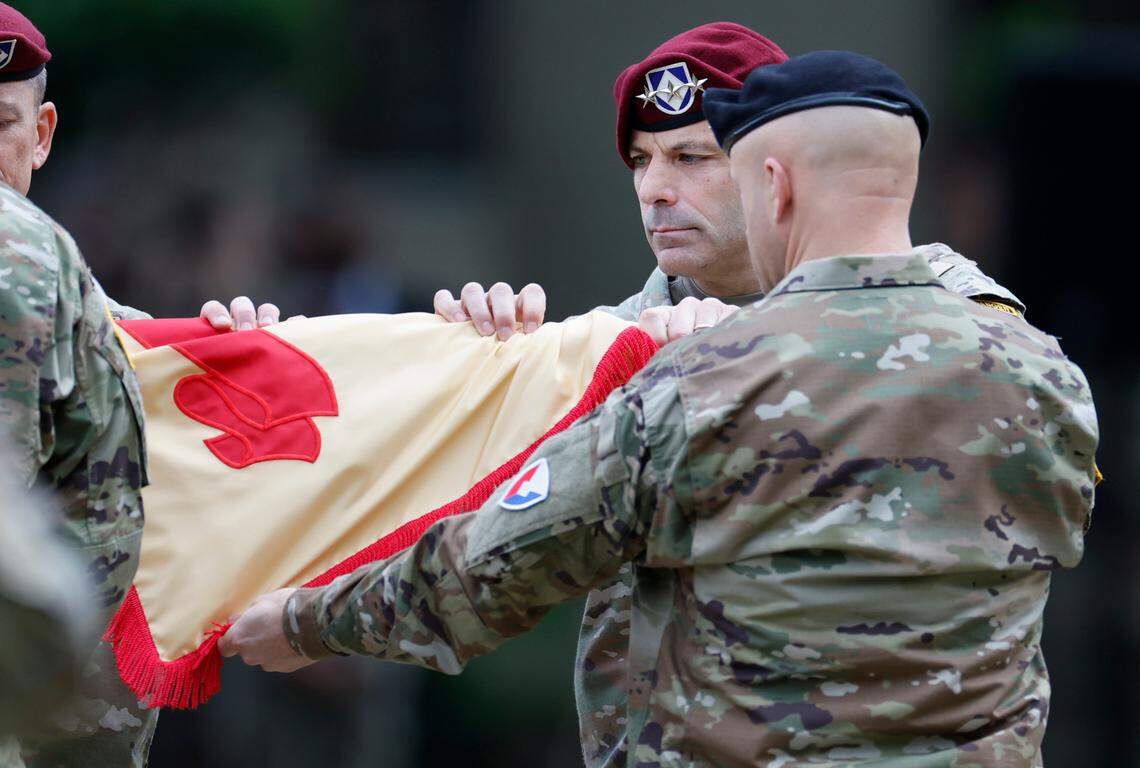 Lt. Gen. Christopher Donahue, Commanding General of the XVIII Airborne Corps and Ft. Liberty, helps case the Ft. Bragg garisson colors during a ceremony redesignating Fort Bragg as Fort Liberty Friday, June 2, 2023. Ft. Liberty, with a population of 282,000 including over 50,000 service members, is the largest military installation by population in the country. The redesignation was mandated in the 2021 National Defense Authorization Act as part of an effort to remove titles with ties to the confederacy. Fort Bragg was named after Gen. Braxton Bragg, a Confederate officer and North Carolina native.