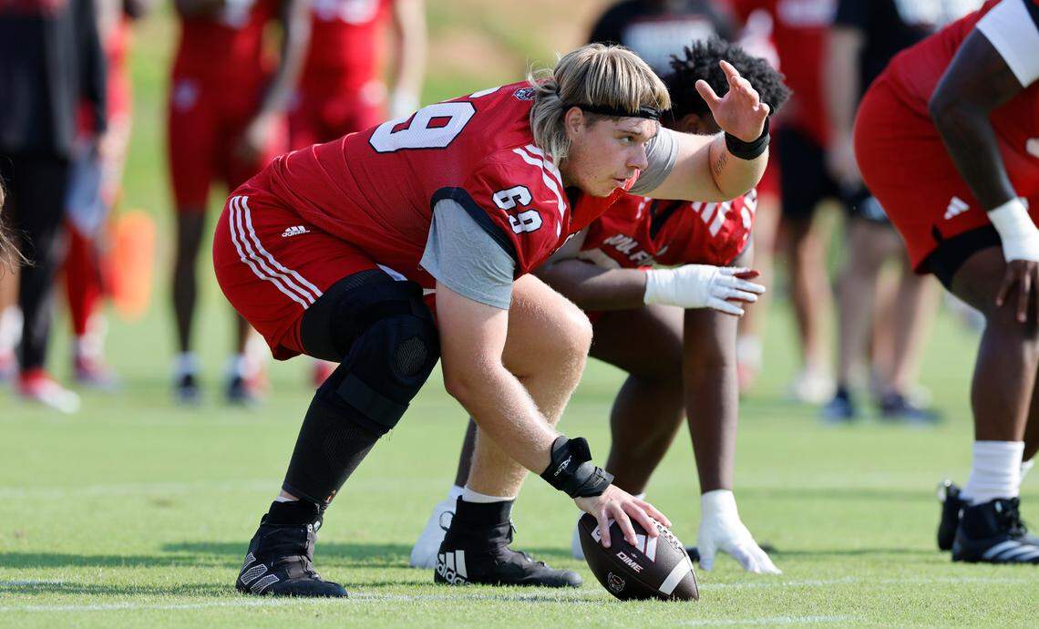 N.C. State offensive lineman Dawson Jaramillo (69) gets ready to snap the ball during the Wolfpack’s first practice in Raleigh, N.C., Wednesday, July 31, 2024.