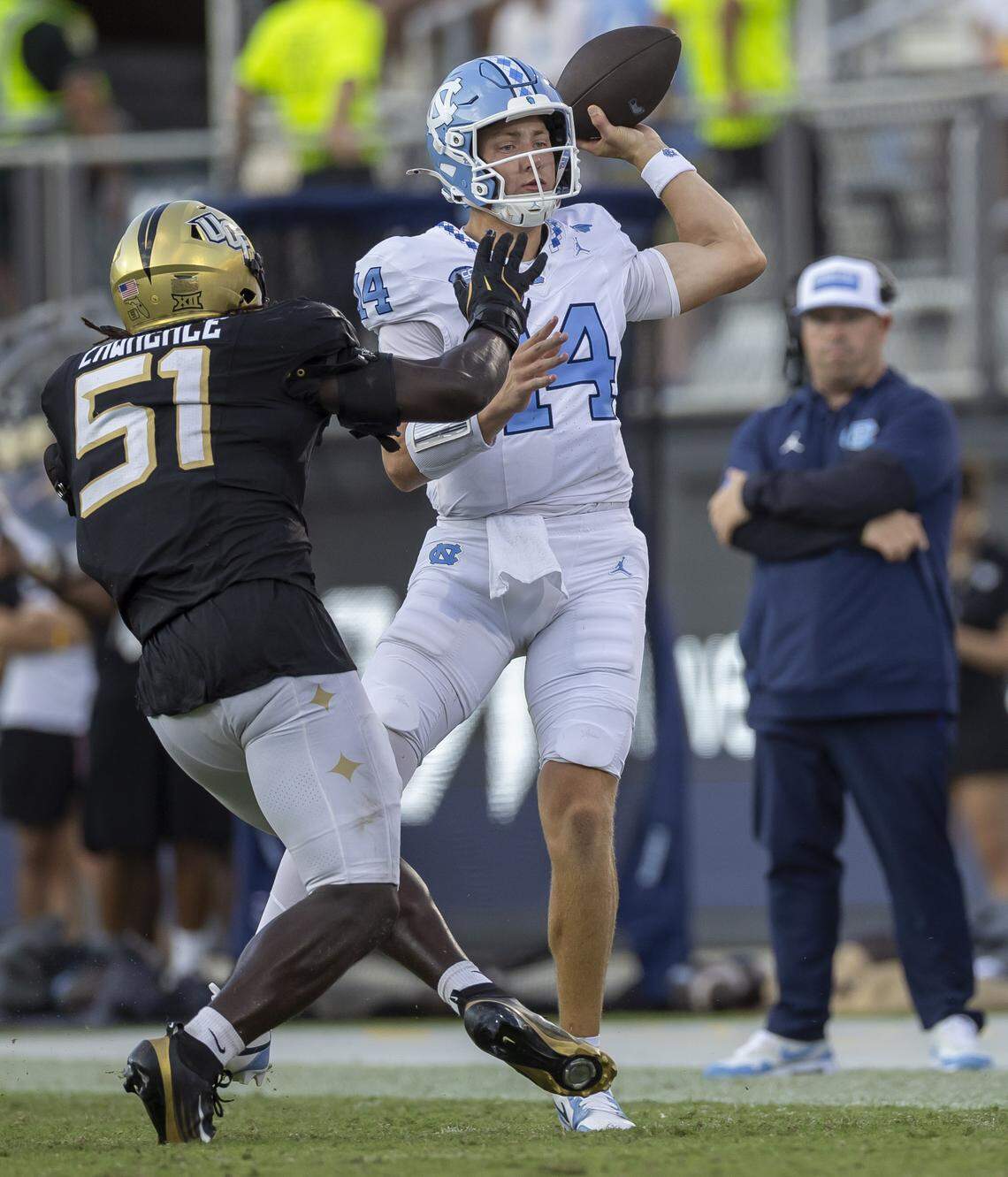 North Carolina quarterback Max Johnson (14) is pressured by UCF defensive end Malachi Lawrence (51) in the third quarter on Saturday, September 20, 2025 at Acrisure Bounce House Stadium in Orlando, Fla.