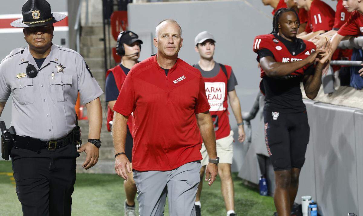 N.C. State head coach Dave Doeren walks off the field after Virginia Tech’s 23-21 victory over N.C. State at Carter-Finley Stadium in Raleigh, N.C., Saturday, Sept. 27, 2025.