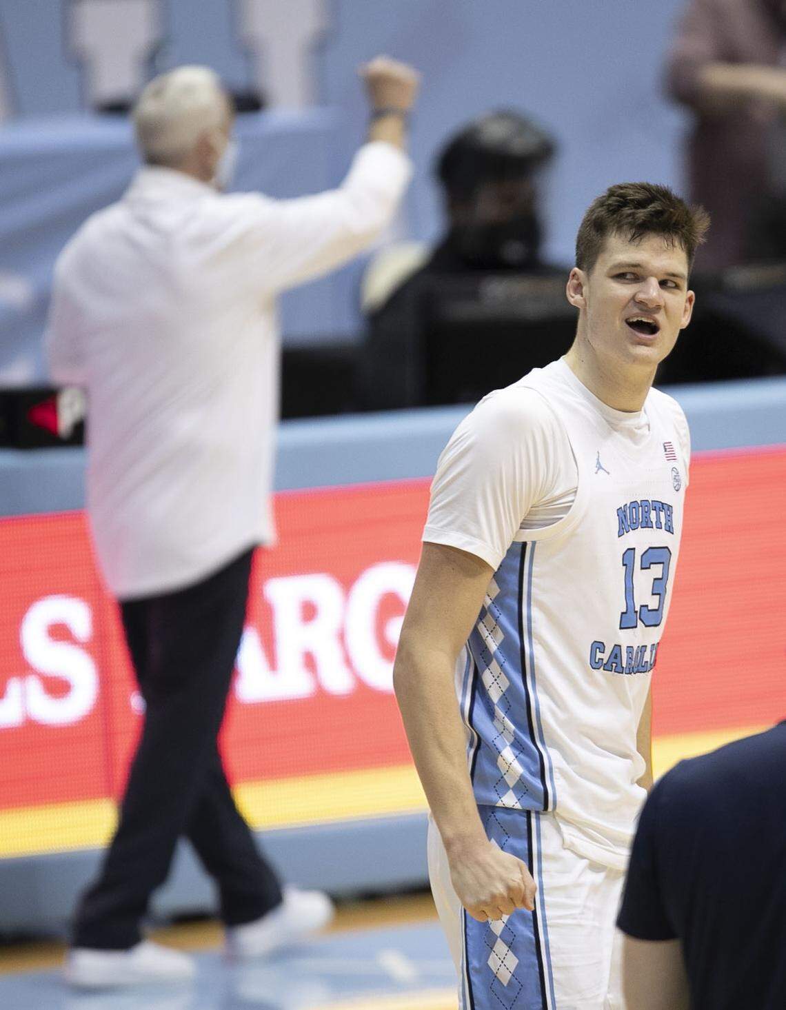 North Carolina’s Walker Kessler (13) soaks up the cheers from fans as time expires after leading the Tar Heels to a 78-70 victory over Florida State on Saturday, February 27, 2021 in Chapel Hill, N.C.