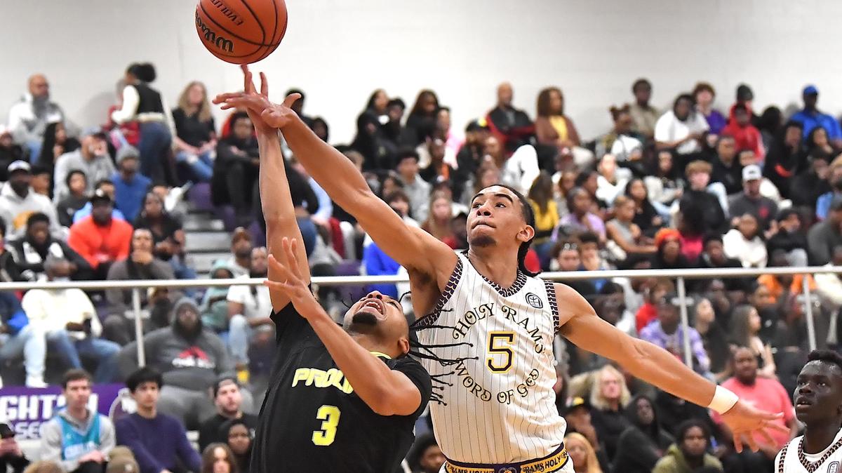 Word of God’s Freddie Delione (5) defends the layup from Prolific Prep’s Aden Holloway (3) in the first half. The Word of God Holy Rams and Prolific Prep (CA) met in the John Wall Holiday Invitational in Raleigh, N.C. on December 30,2022 .
