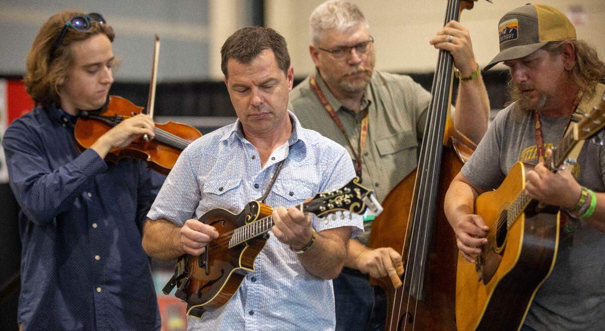 Brian Oberlin and members of Full Cord Bluegrass from Grand Haven, Michigan perform on Thursday, September 29, 2021 at the Raleigh Convention Center in Raleigh, N.C.