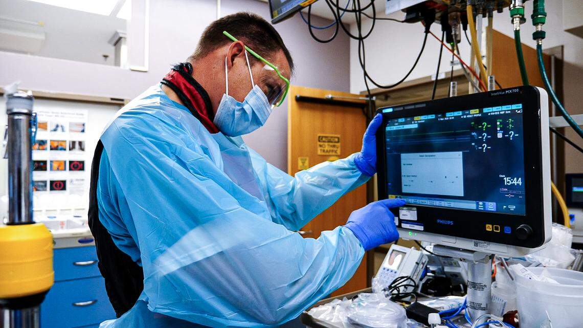Staff Sgt. Troy Svien, a licensed practical nurse from Fort Bragg, helps prepare a trauma operating room at UNC Medical Center in Chapel Hill as part of a new training partnership between UNC and the Army.