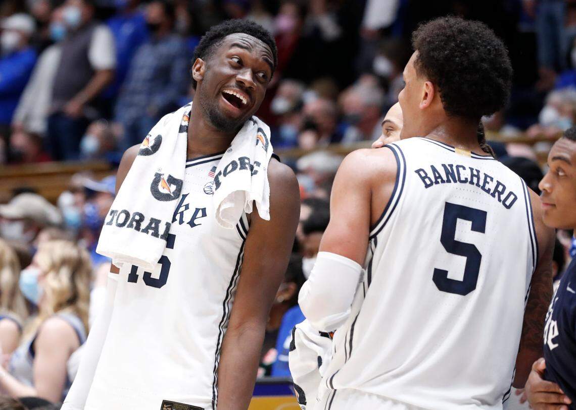 Duke’s Mark Williams (15) laughs with Paolo Banchero (5) late in the second half of Duke’s 88-73 victory over N.C. State at Cameron Indoor Stadium in Durham, N.C., Saturday, January 15, 2022.