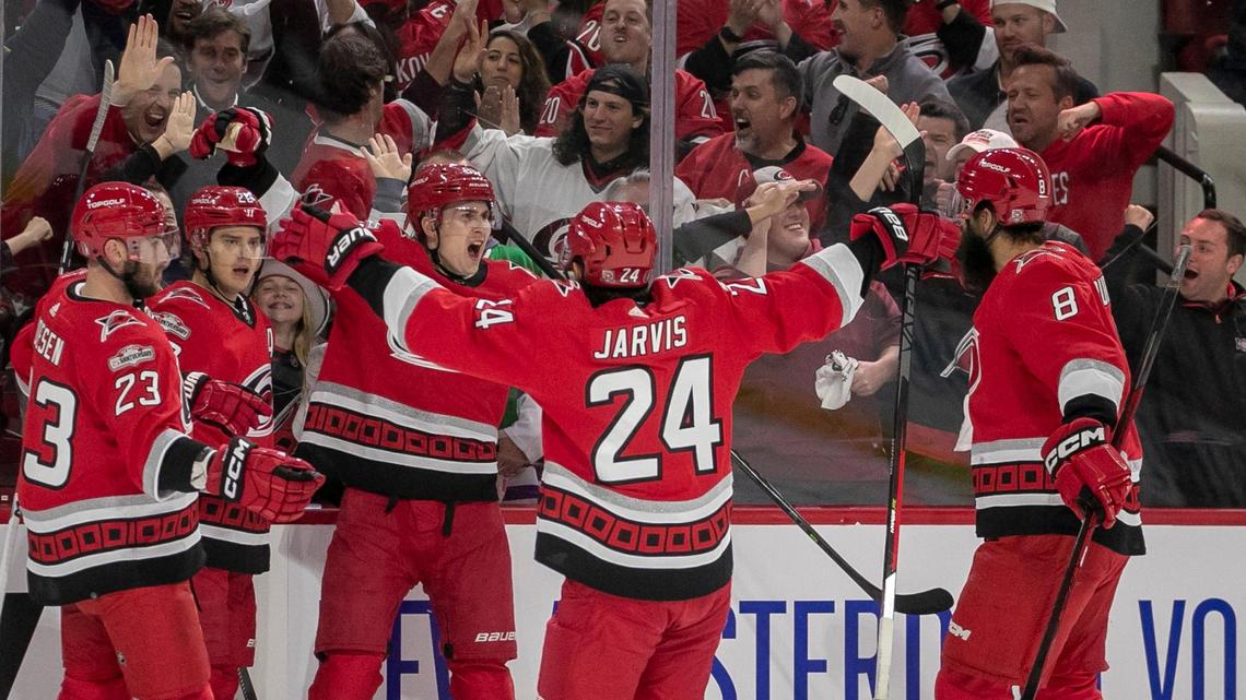 Carolina Hurricanes’ Sebastian Aho (20) celebrates with teammates Stefan Noesen (23), Martin Necas (88), Seth Jarvis (24) and Brent Burns (8) after scoring on New York Islanders goalie Ilya Sorokin (30) to take a 1-0 lead on Tuesday, April 17, 2023 at PNC Arena in Raleigh, N.C.
