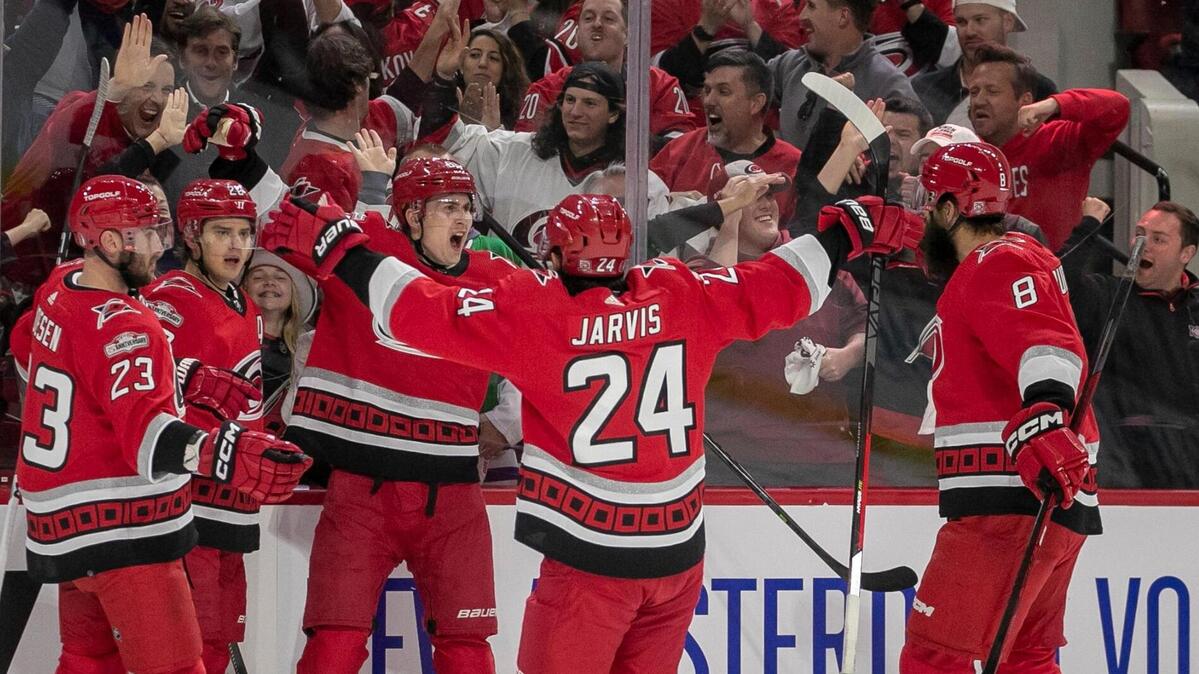 Carolina Hurricanes’ Sebastian Aho (20) celebrates with teammates Stefan Noesen (23), Martin Necas (88), Seth Jarvis (24) and Brent Burns (8) after scoring on New York Islanders goalie Ilya Sorokin (30) to take a 1-0 lead on Tuesday, April 17, 2023 at PNC Arena in Raleigh, N.C.
