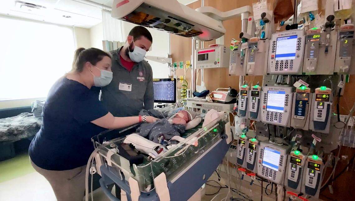 Parents Tayler and Nick Monroe spend time with their son Owen at Duke Health. Owen, who was born with an extremely rare condition that fuses the two main arteries of the heart together, is the first person to ever undergo a partial heart transplant.