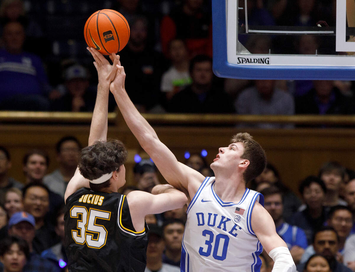 Duke’s Kyle Filipowski blocks a shot by La Salle’s Rokas Jocius during the first half of the Blue Devils’ game on Tuesday, Nov. 21, 2023, at Cameron Indoor Stadium in Durham, N.C.