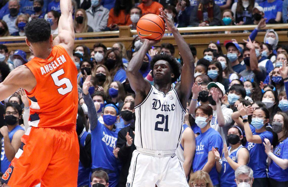 Duke’s A.J. Griffin (21) shoots a three-pointer as Syracuse’s Frank Anselem (5) defends during the first half of Duke’s game against Syracuse at Cameron Indoor Stadium in Durham, N.C., Saturday, Jan. 22, 2022.