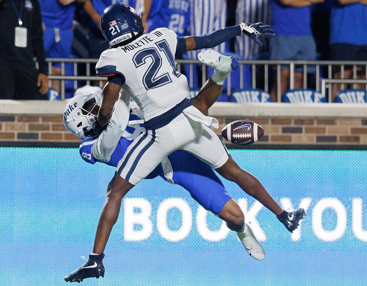 Connecticut’s Lee Molette III breaks up a pass intended for Duke’s Jordan Moore during the second half of the Blue Devils’ 26-21 win on Saturday, Sept. 14, 2024, at Wallace Wade Stadium in Durham, N.C.