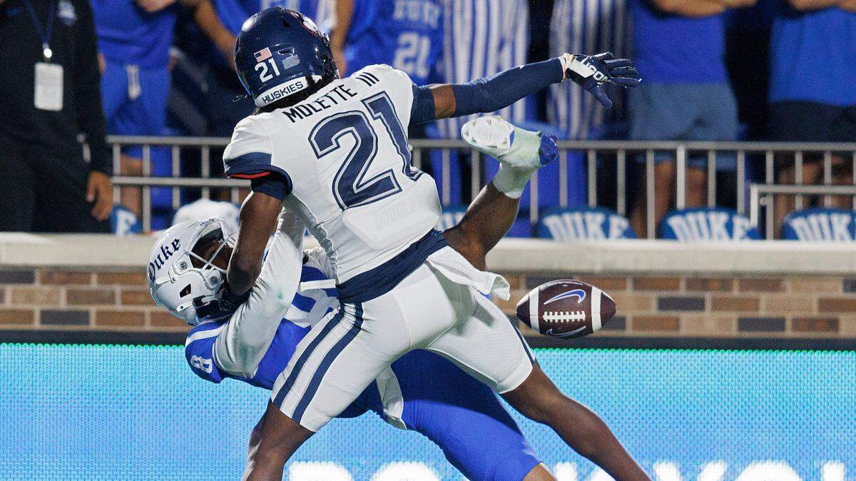 Connecticut’s Lee Molette III breaks up a pass intended for Duke’s Jordan Moore during the second half of the Blue Devils’ 26-21 win on Saturday, Sept. 14, 2024, at Wallace Wade Stadium in Durham, N.C.