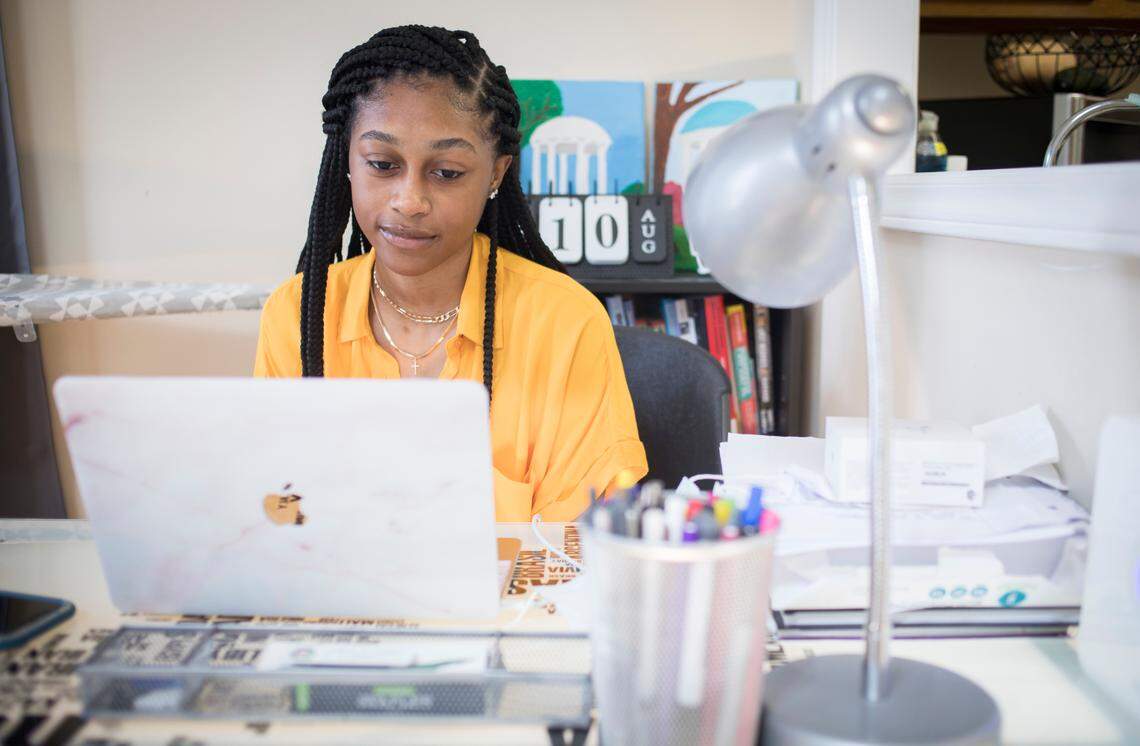 First year UNC-Chapel Hill student Kiana Suggs tunes into her first college class, which is being held virtually, on her computer at her brother Chris’s apartment in Durham, N.C. on Monday, Aug. 10, 2020.