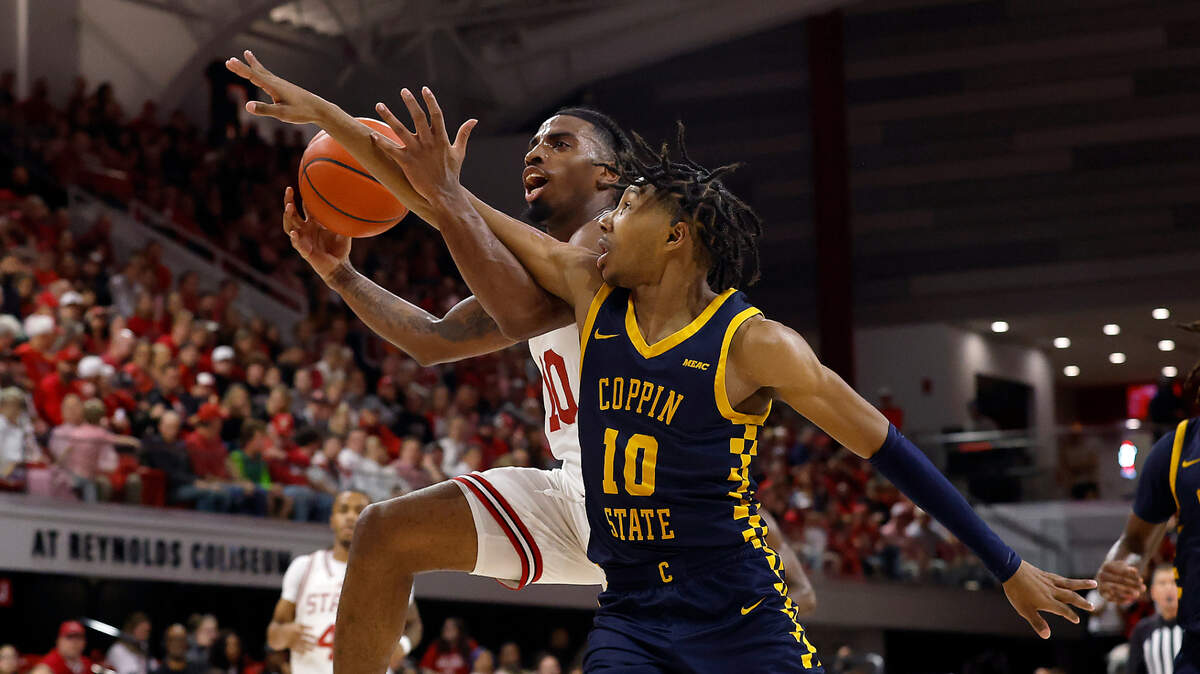N.C. State’s Marcus Hill drives to the basket past Coppin State’s Camaren Sparrow during the first half of the Wolfpack’s game on Tuesday, Dec. 10, 2024, at Reynolds Coliseum in Raleigh, N.C.