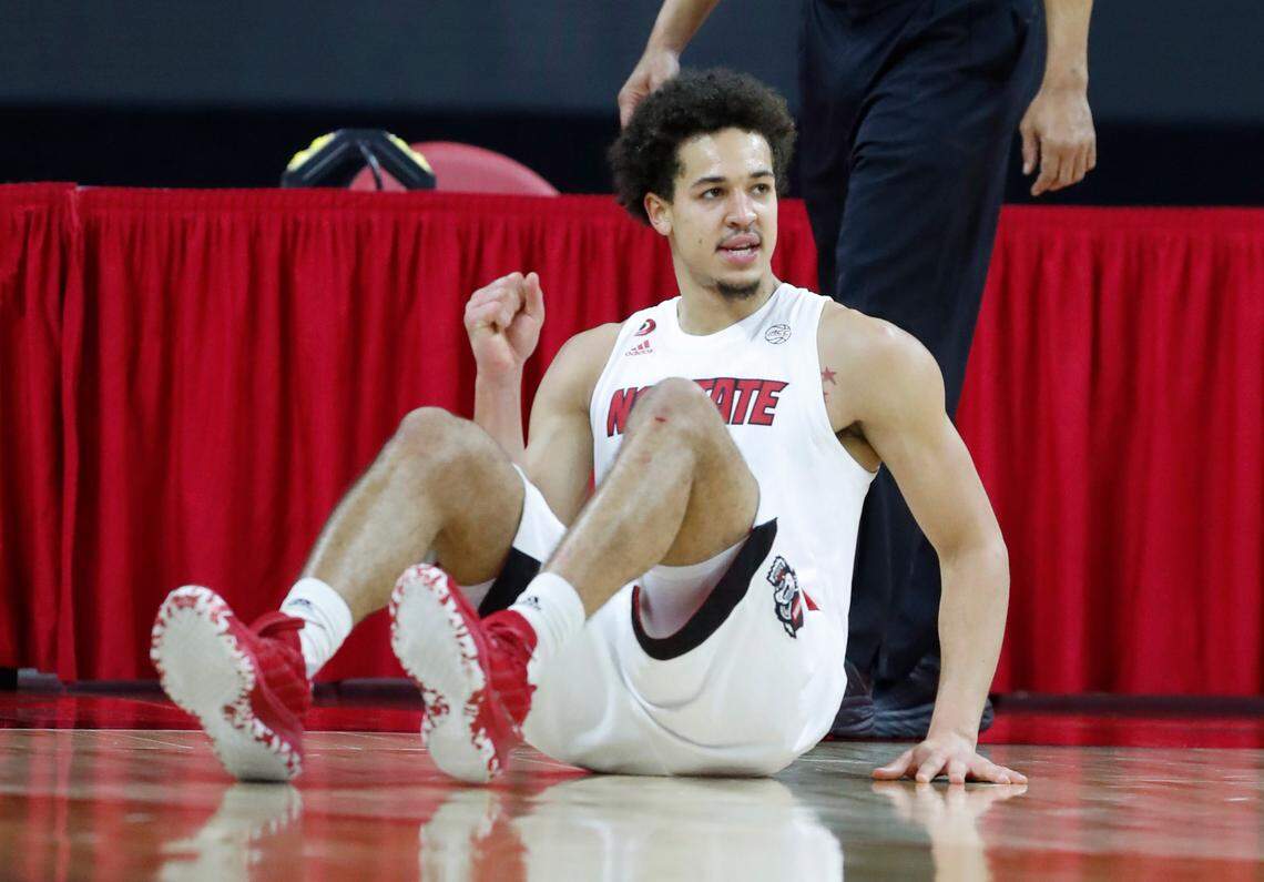 N.C. State’s Jericole Hellems (4) celebrates after Campbell’s Cedric Henderson Jr. was called for a foul for charging into Hellems during the second half of N.C. State’s 69-50 victory over Campbell at PNC Arena in Raleigh, N.C., Saturday, Dec. 19, 2020.