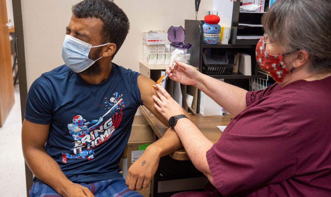 Prather Presley grimaces as he receives his first dose of the Pfizer COVID-19 vaccine at the Robeson County Health Department on Tuesday, August 24, 2021.