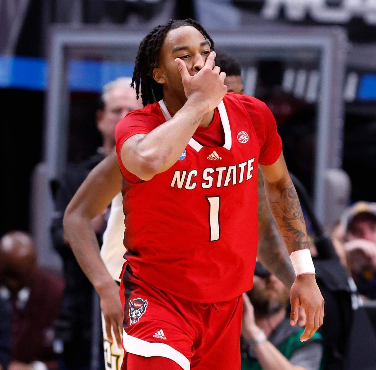 N.C. State’s Jayden Taylor (1) celebrates hitting a three-pointer during the first half of N.C. State’s game against Marquette in their NCAA Tournament Sweet 16 game at the American Airlines Center in Dallas, Texas, Friday, March 29, 2024.