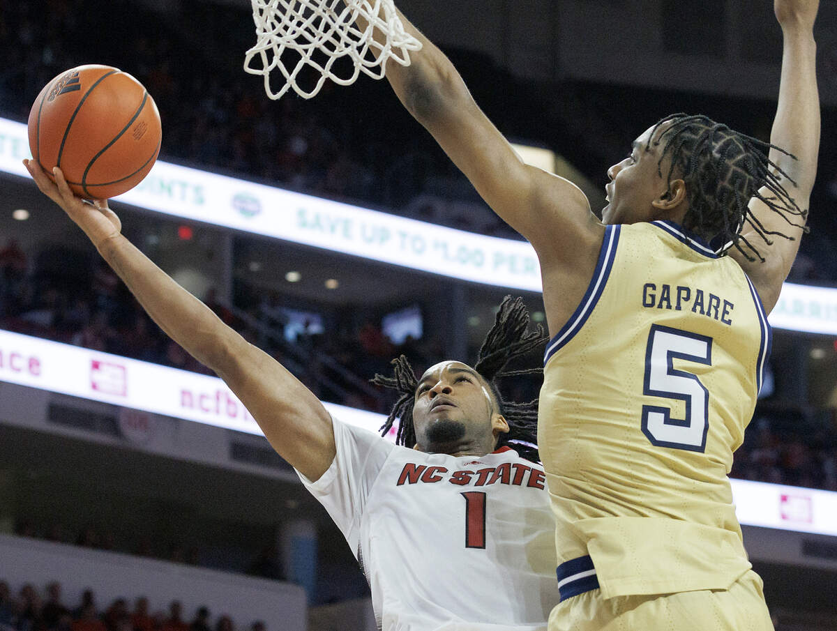 N.C. State’s Jayden Taylor drives to the basket against Georgia Tech’s Tafara Gapare during the second half of the Wolfpack’s 82-76 win on Saturday, Feb. 3, 2024, at PNC Arena in Raleigh, N.C.
