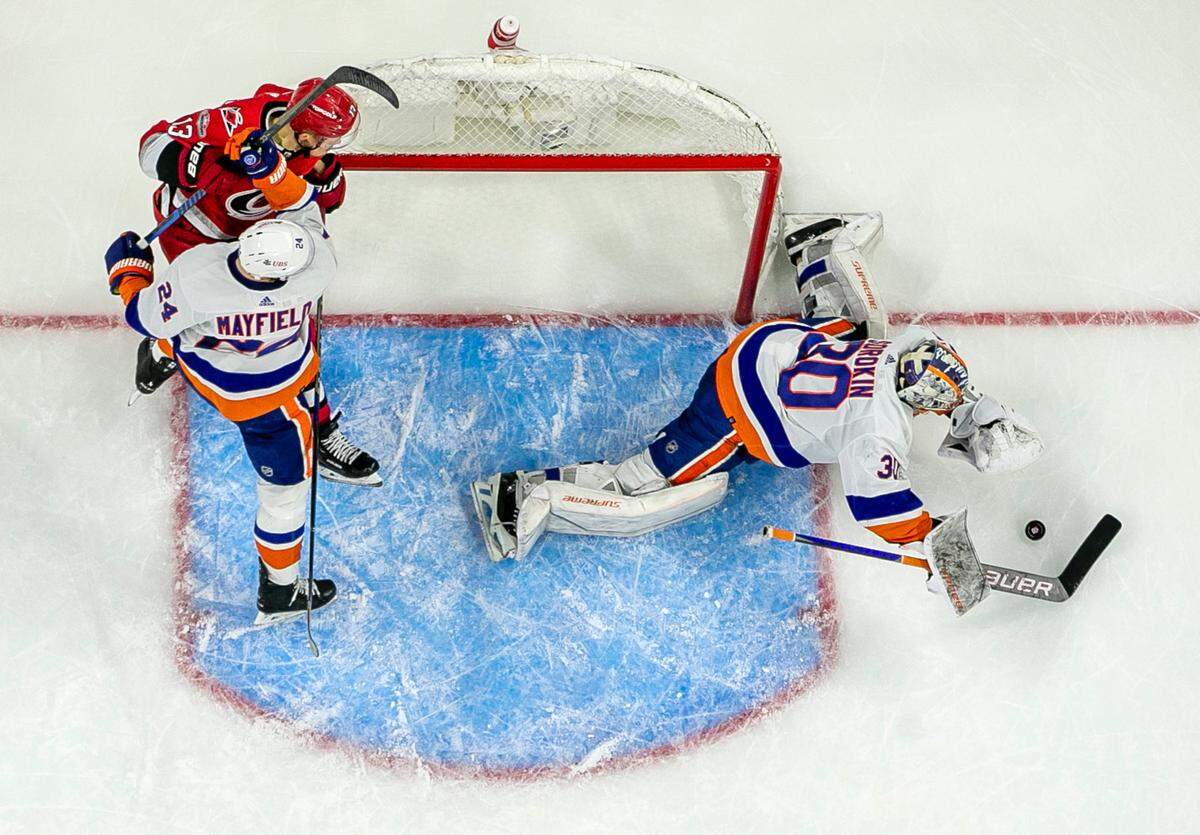 New York Islanders goalie Ilya Sorokin (30) makes a save against the Carolina Hurricanes in the third period during Game 5 of their Stanley Cup series on Tuesday, April 25, 2023 at PNC Arena in Raleigh, N.C. Sorokin made 34 saves in the Islanders’ 3-2 victory.