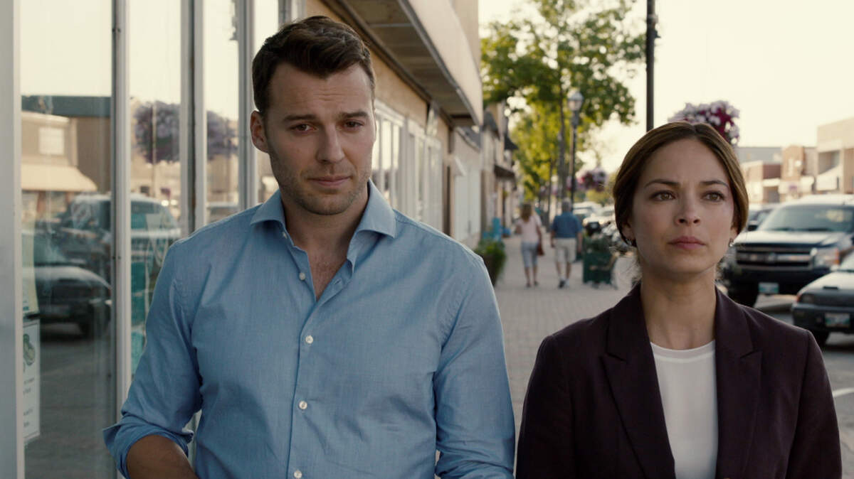 Peter Mooney, left, as Billy Crawford and Kristin Kreuk as Joanna Hanley in the new CW legal drama "Burden of Truth."
