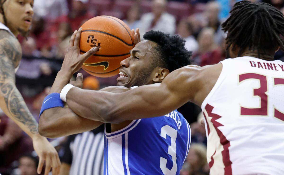 Duke’s Jeremy Roach (3) drives around Florida State’s Jaylan Gainey (33) during the first half of Duke’s game against Florida State University at the Tucker Center in Tallahassee, Fla. Sat. February 17, 2024.