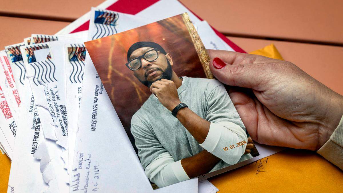 Heather Mitchell shows a photograph of her husband Marcus Mitchell who has been on death row in Raleigh’s Central Prison for 27 years. He has long been an advocate for death row inmates receiving educational programming.