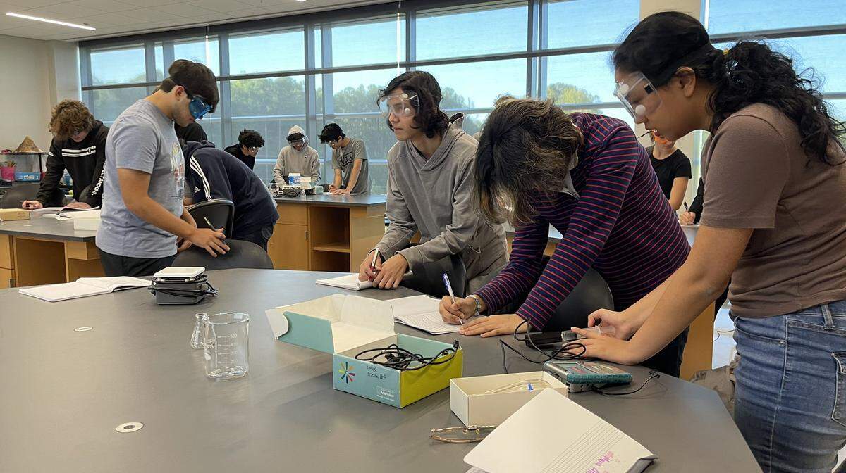 Students participate in a chemistry lab at the Wake Early College of Information and Biotechnologies in Morrisville, N.C. The opening of the campus they’ll share with Parkside Middle School will be delayed.
