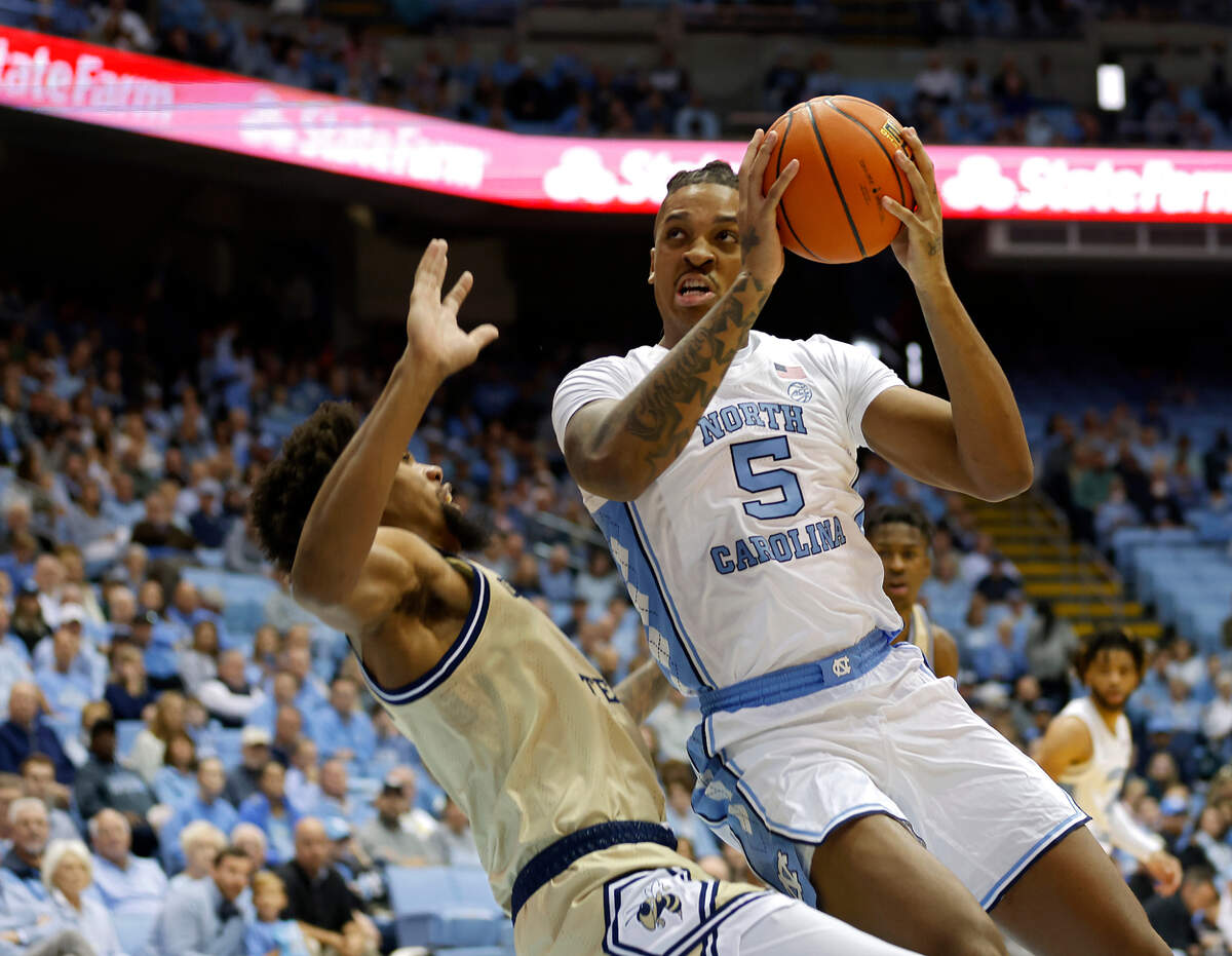 North Carolina’s Armando Bacot is fouled by Georgia Tech’s Javon Franklin during the first half of a men’s basketball game at the Dean E. Smith Center on Saturday, Dec. 10, 2022, in Chapel Hill, N.C.