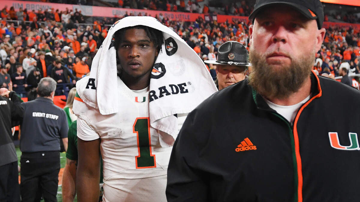 Nov 30, 2024; Syracuse, New York, USA; Miami Hurricanes quarterback Cam Ward (1) walks off the field following a game against the Syracuse Orange at the JMA Wireless Dome.
