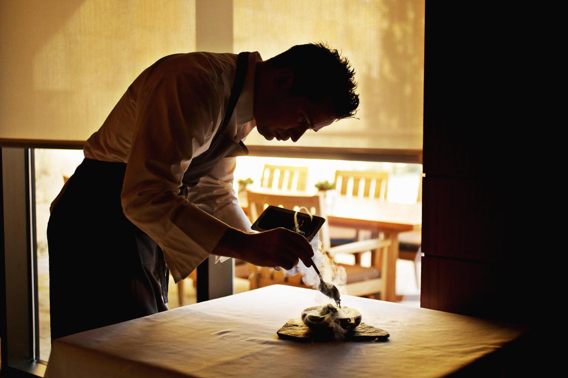 Herons’ executive chef Steven Devereaux Greene adds the finishing touches to the beet dish in the Cary restaurant’s private dining room Tuesday, Jan. 15, 2019.