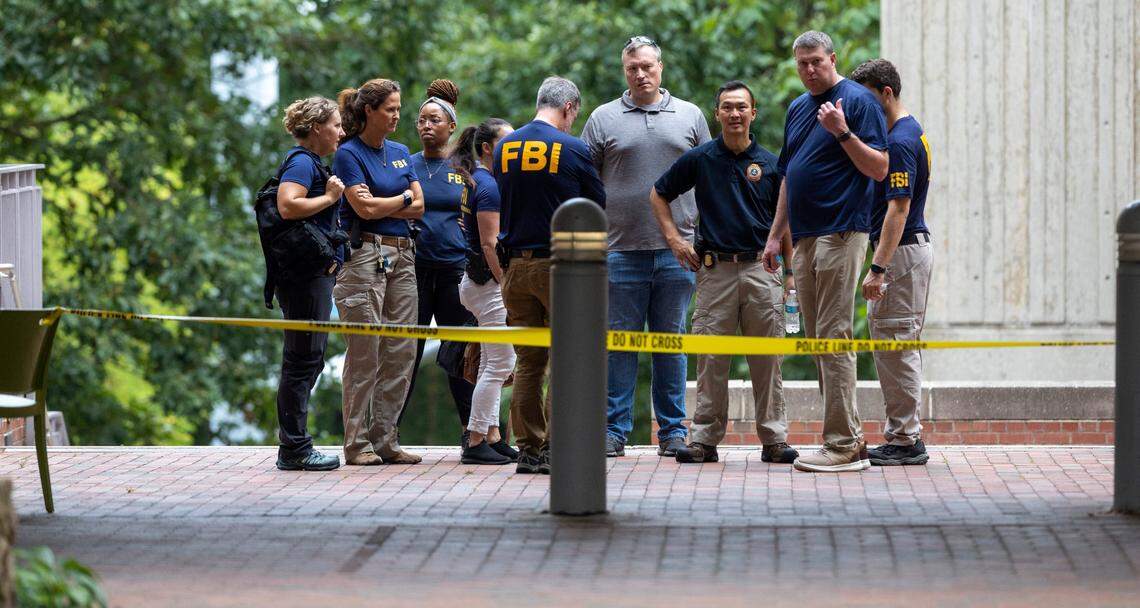 FBI agents gather outside the Caudill Laboratories building to help investigate a shooting on the University of North Carolina campus on Monday, August 28. 2023 in Chapel Hill, N.C.