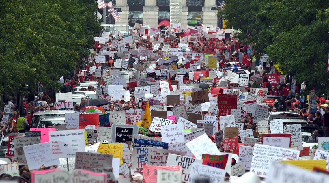 Thousands of teachers crowd Fayetteville Street in Raleigh, N.C. Wednesday, May 16, 2018 as they march to the N.C. Legislative building during the  “March for Students and Rally for Respect,” the largest act of organized teacher political action in state history.